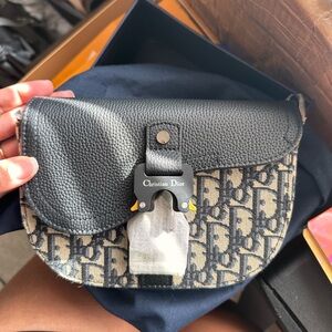 Oblique Jacquard Grained Calfskin Saddle Pouch With Strap Beige